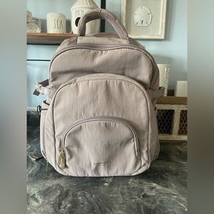 Highly sought after Isaac Mizrahi backpack. Brand new, never used, tags removed